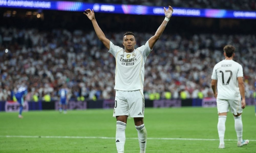 Com um a menos, Real vira jogo com dois gols de pênaltis de Mbappé e vence Olympique na Champions League